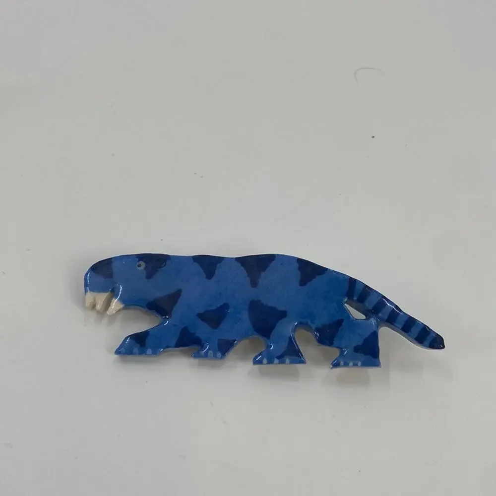 Vintage blue ceramic sabertooth tiger pin